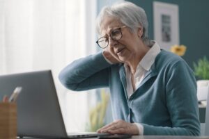 Senior woman having neck pain