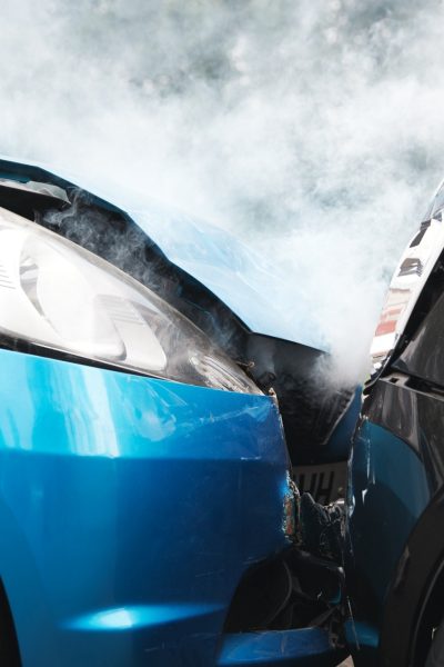 Close Up Of Two Cars Damaged In Road Traffic Accident